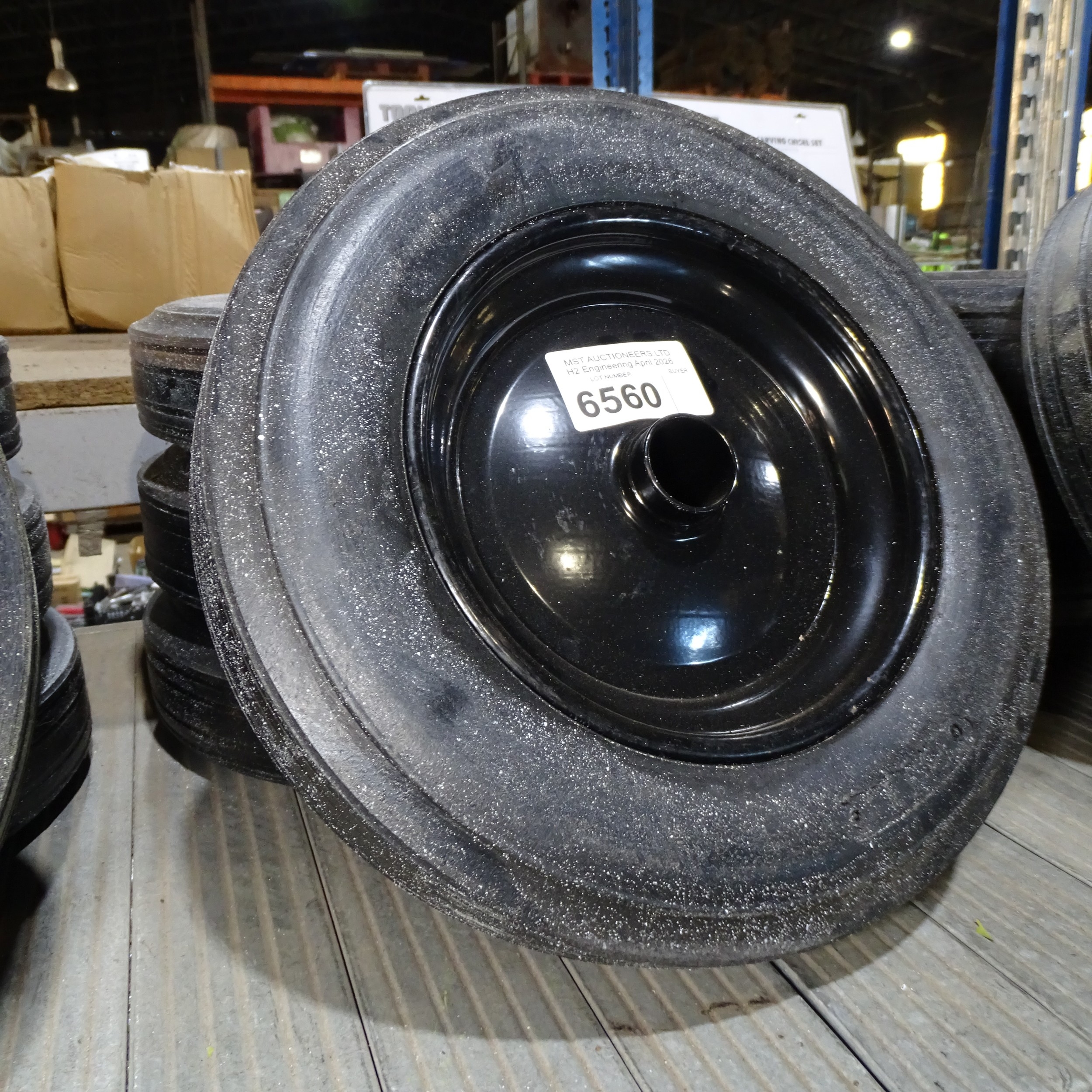 4 x small black metal wheels fitted with BIL solid rubber tyres with no ...