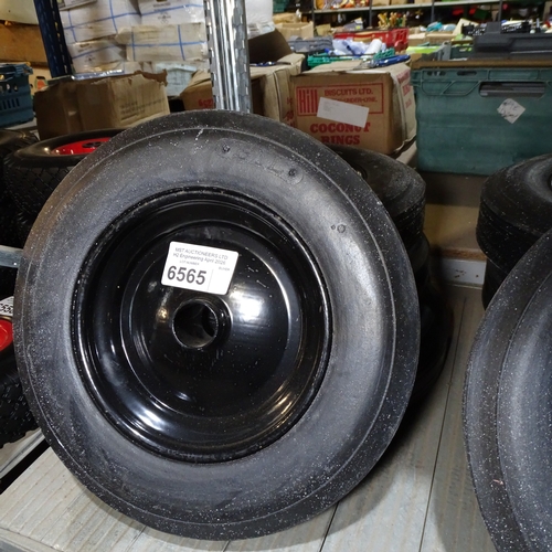 4 x small black metal wheels fitted with BIL solid rubber tyres with no ...