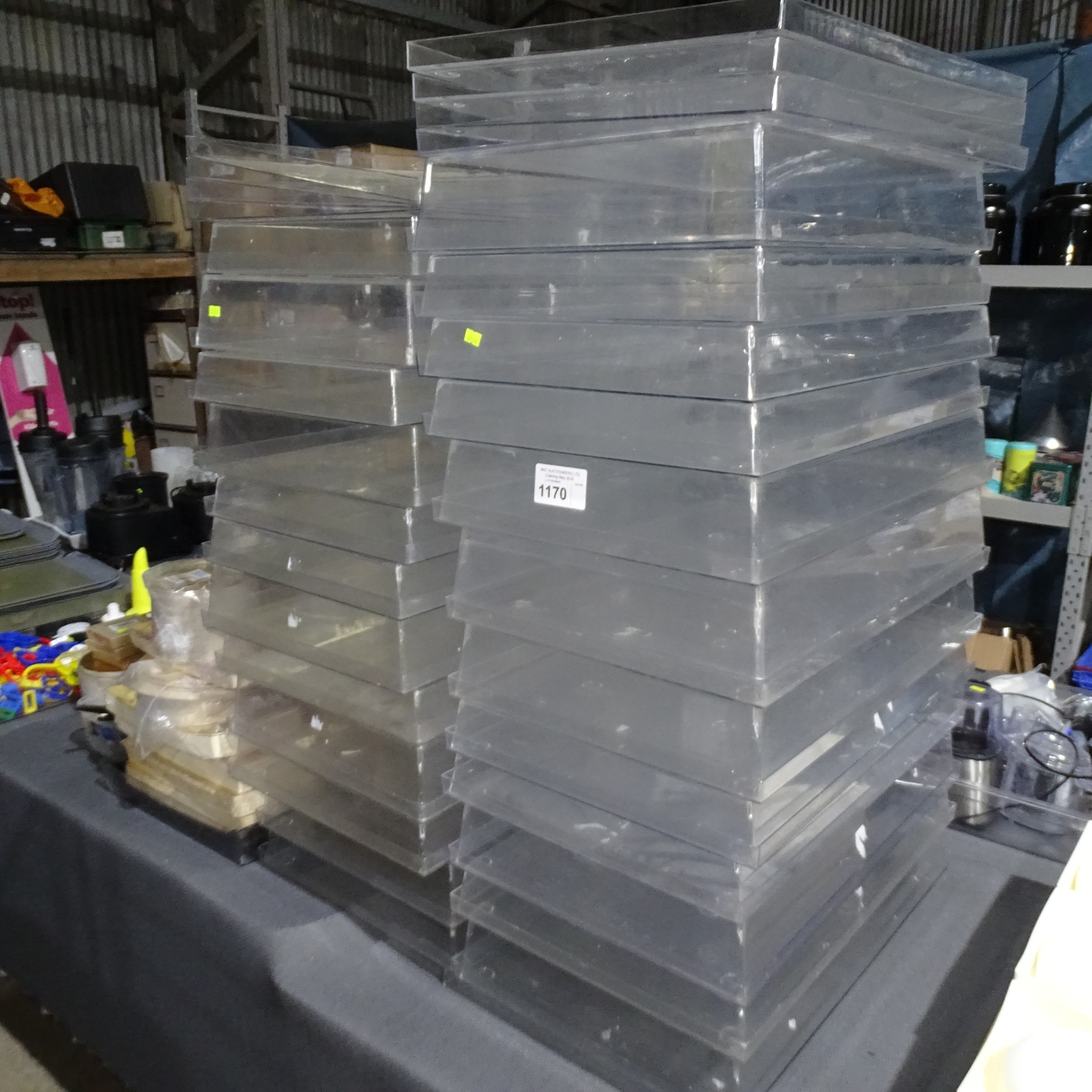 A large quantity of over 20 used plastic deep stackable trays and lid ...