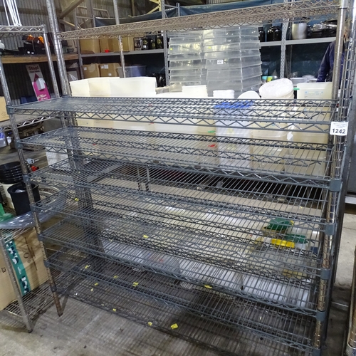 1242 - VAT. A grey and chrome effect catering type rack with 7 adjustable height shelves approx 150*40*181c... 