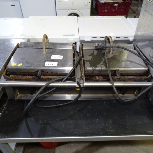 1253 - VAT. A twin commercial stainless steel Panini grill by roller grill one side requires attention trad... 