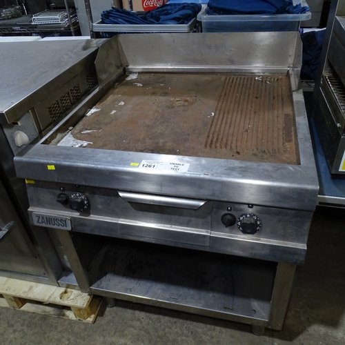 1261 - VAT. A commercial stainless steel griddle by Zanussi, gas fired on a stand with shelf beneath Trade... 