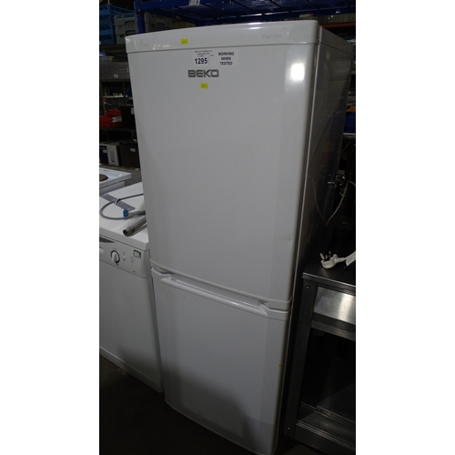 1295 - A fridge freezer by Beko A-class trade. Tested Working