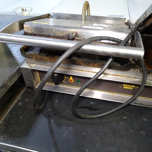 1253 - VAT. A twin commercial stainless steel Panini grill by roller grill one side requires attention trad... 