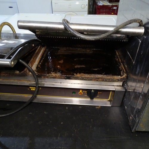 1253 - VAT. A twin commercial stainless steel Panini grill by roller grill one side requires attention trad... 
