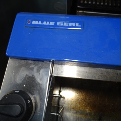 1276 - VAT. A gas fired steak house grill by blueseal missing stand and grill pan trade... 