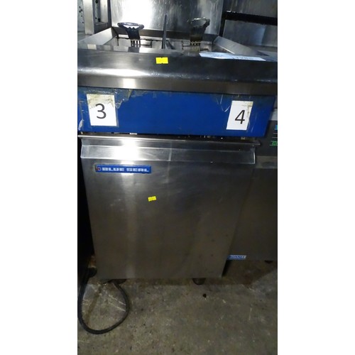 1285 - VAT. A commercial stainless steel double basket deep fryer by Blue Seal gas trade... 