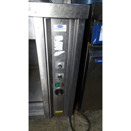 1288 - VAT. A commercial stainless steel heated cabinet, no doors, gantry above approx 150*70*160cm trade... 
