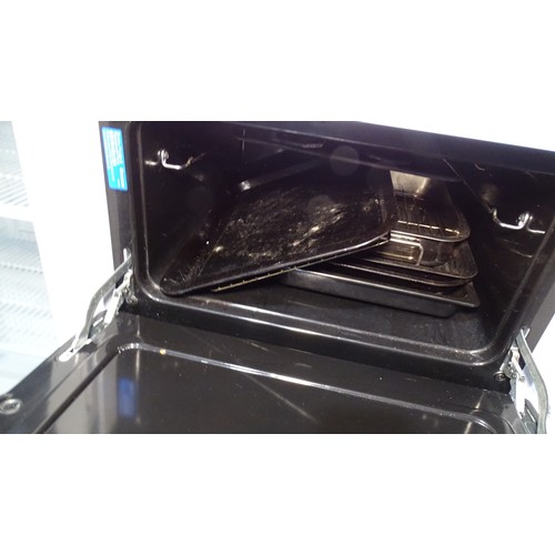 1297 - An electric oven by Indesit - 4 ring hob with grill and oven below Trade