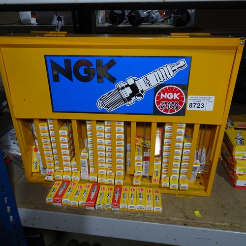 A quantity of various NGK Spark plugs and an NGK Display stand