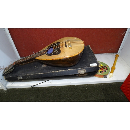 5002 - A vintage mandolin, a tambourine and a recorder