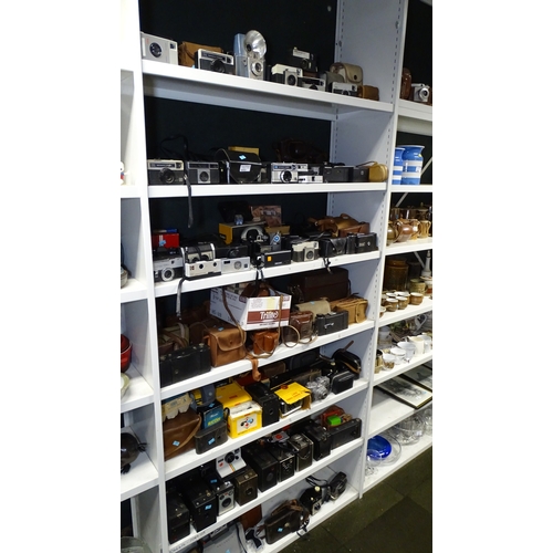 5053 - A large quantity of miscellaneous vintage cameras including; early box cameras, folding bellows came... 
