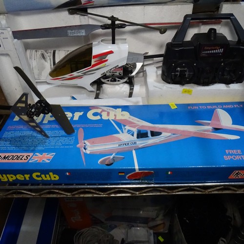 2 X radio controlled helicopters 2x controllers and a hyper cub model ...