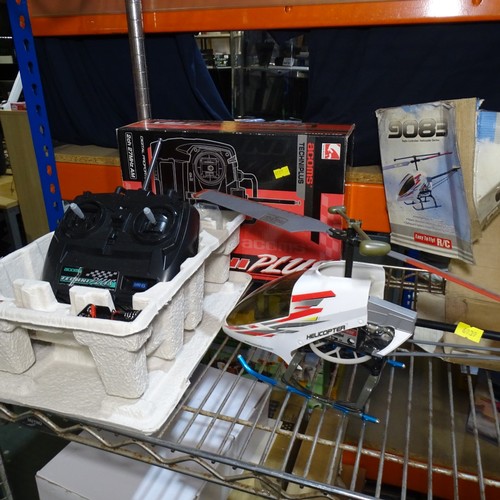 2 X radio controlled helicopters 2x controllers and a hyper cub model ...