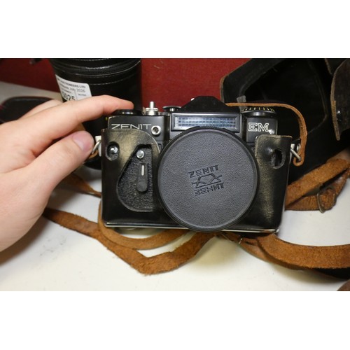 5025 - A vintage Zenit camera, a pair of vintage binoculars and various lenses and other equipment