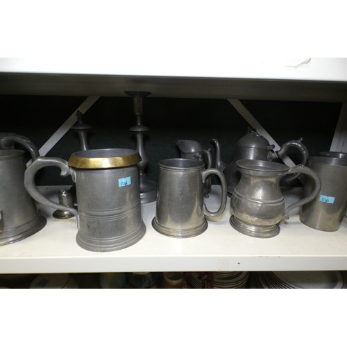 5045 - A quantity of various vintage pewter tankards and other decorative pewter ware (two shelves)... 