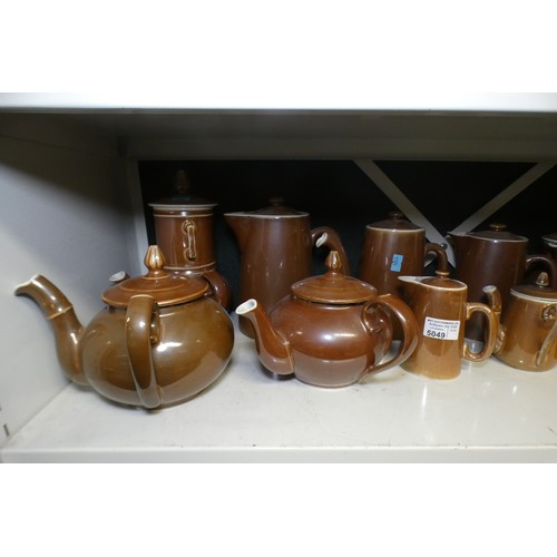 5049 - A quantity of miscellaneous brown pottery teapots, coffee pots, jugs and miscellaneous stoneware kit... 