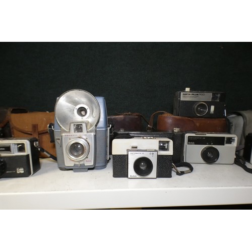 5053 - A large quantity of miscellaneous vintage cameras including; early box cameras, folding bellows came... 