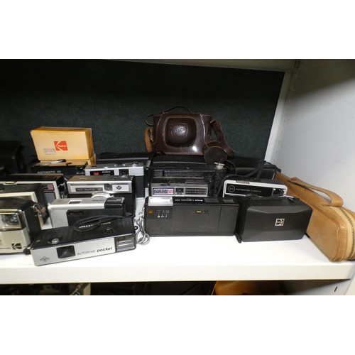 5053 - A large quantity of miscellaneous vintage cameras including; early box cameras, folding bellows came... 