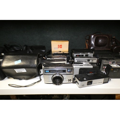 5053 - A large quantity of miscellaneous vintage cameras including; early box cameras, folding bellows came... 