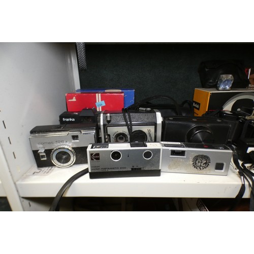 5053 - A large quantity of miscellaneous vintage cameras including; early box cameras, folding bellows came... 