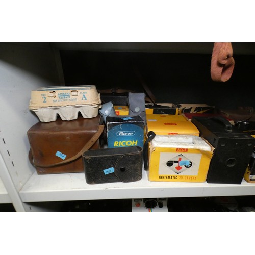 5053 - A large quantity of miscellaneous vintage cameras including; early box cameras, folding bellows came... 