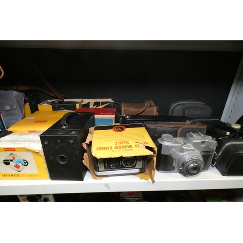 5053 - A large quantity of miscellaneous vintage cameras including; early box cameras, folding bellows came... 