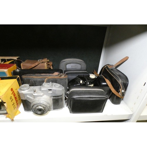 5053 - A large quantity of miscellaneous vintage cameras including; early box cameras, folding bellows came... 