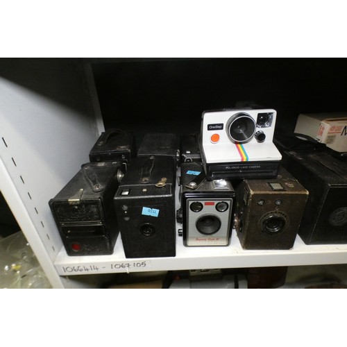 5053 - A large quantity of miscellaneous vintage cameras including; early box cameras, folding bellows came... 