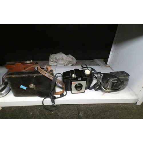 5053 - A large quantity of miscellaneous vintage cameras including; early box cameras, folding bellows came... 