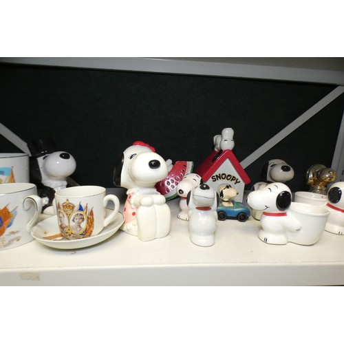 5054 - A quantity of royal commemorative beakers and a quantity of Snoopy ornaments (one shelf)... 