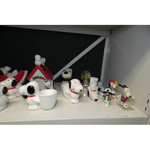 5054 - A quantity of royal commemorative beakers and a quantity of Snoopy ornaments (one shelf)... 