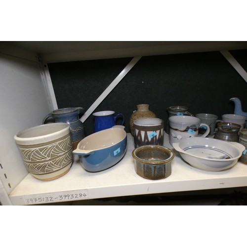 5055 - A quantity of miscellaneous large stoneware vases, jugs, kitchen pots and beakers etc (two shelves)... 