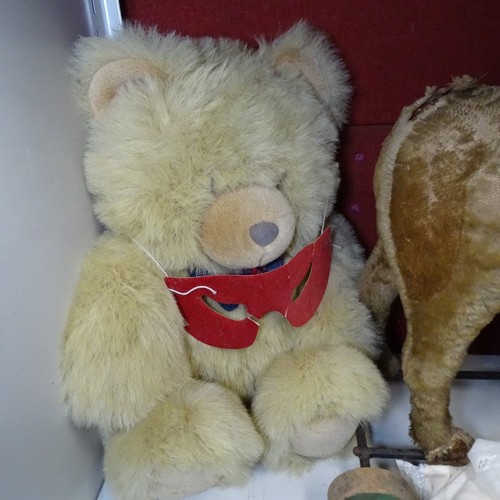 5021 - A quantity of miscellaneous vintage soft toys and a porcelain head doll. Note Cows head is damaged. ... 