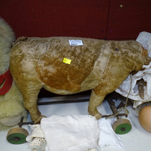 5021 - A quantity of miscellaneous vintage soft toys and a porcelain head doll. Note Cows head is damaged. ... 