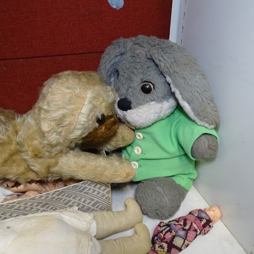 5021 - A quantity of miscellaneous vintage soft toys and a porcelain head doll. Note Cows head is damaged. ... 