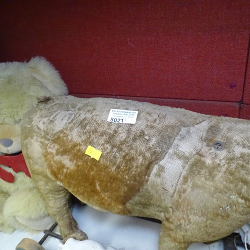 5021 - A quantity of miscellaneous vintage soft toys and a porcelain head doll. Note Cows head is damaged. ... 