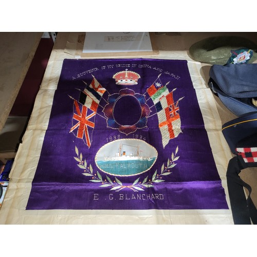 A mixed lot of Military artefacts, to include an embroidered banner, a ...