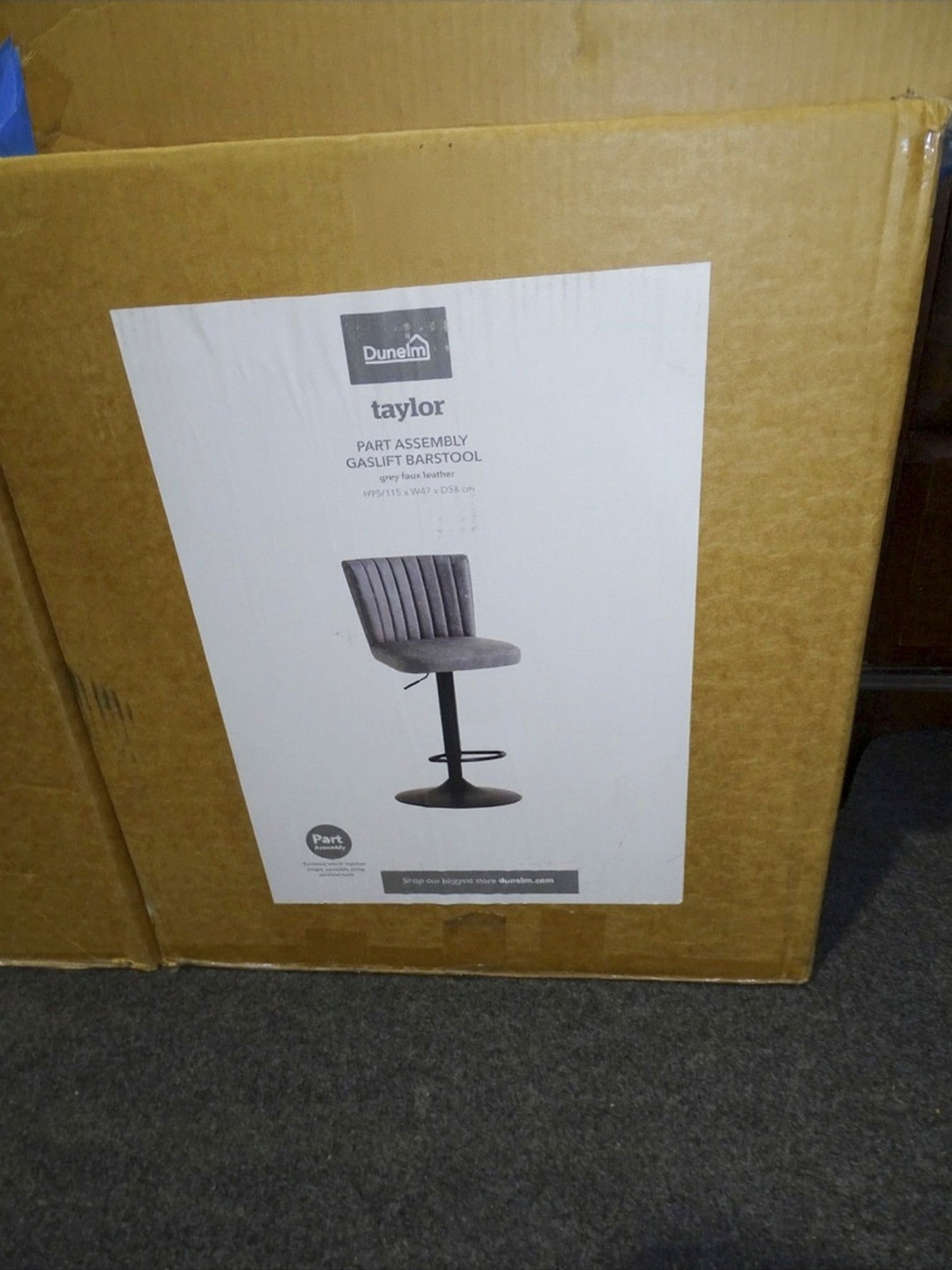 A boxed unused rise and fall grey upholstered bar stool by taylor