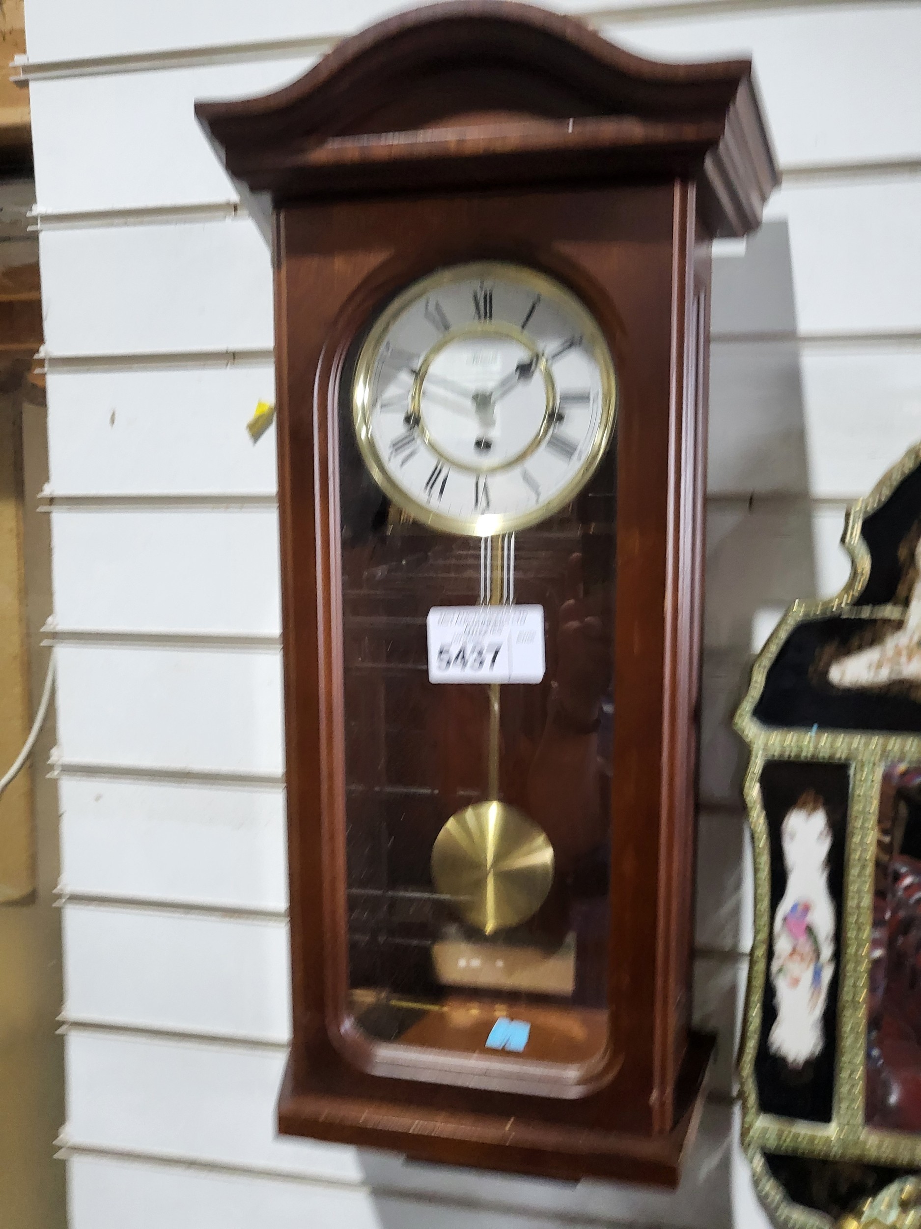 A Vintage Wall Mounted clock by 
