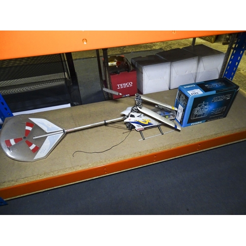 A large Radio controlled helicopter by Kyosho and a multi and ...