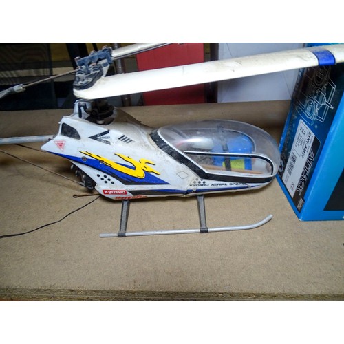 A large Radio controlled helicopter by Kyosho and a multi and ...