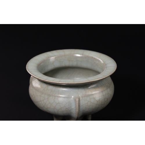 231 - A CHINESE CELADON-GLAZED STONEWARE TRIPOD CENSER. - The vessel is expertly modelled after the archai... 