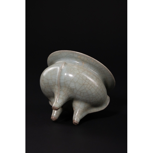 231 - A CHINESE CELADON-GLAZED STONEWARE TRIPOD CENSER. - The vessel is expertly modelled after the archai... 