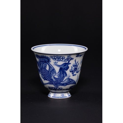 232 - A CHINESE BLUE AND WHITE PORCELAIN DRAGON AND PHOENIX CUP, DAOGUANG MARK. - The exterior is expertly... 