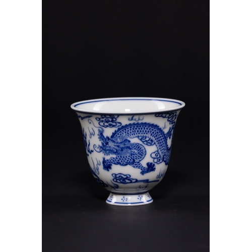 232 - A CHINESE BLUE AND WHITE PORCELAIN DRAGON AND PHOENIX CUP, DAOGUANG MARK. - The exterior is expertly... 