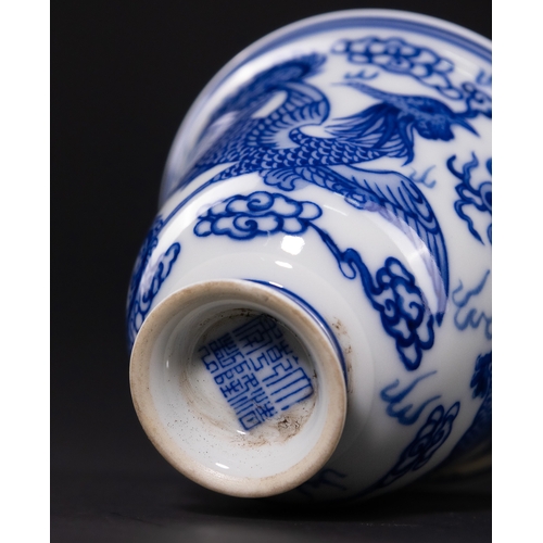 232 - A CHINESE BLUE AND WHITE PORCELAIN DRAGON AND PHOENIX CUP, DAOGUANG MARK. - The exterior is expertly... 