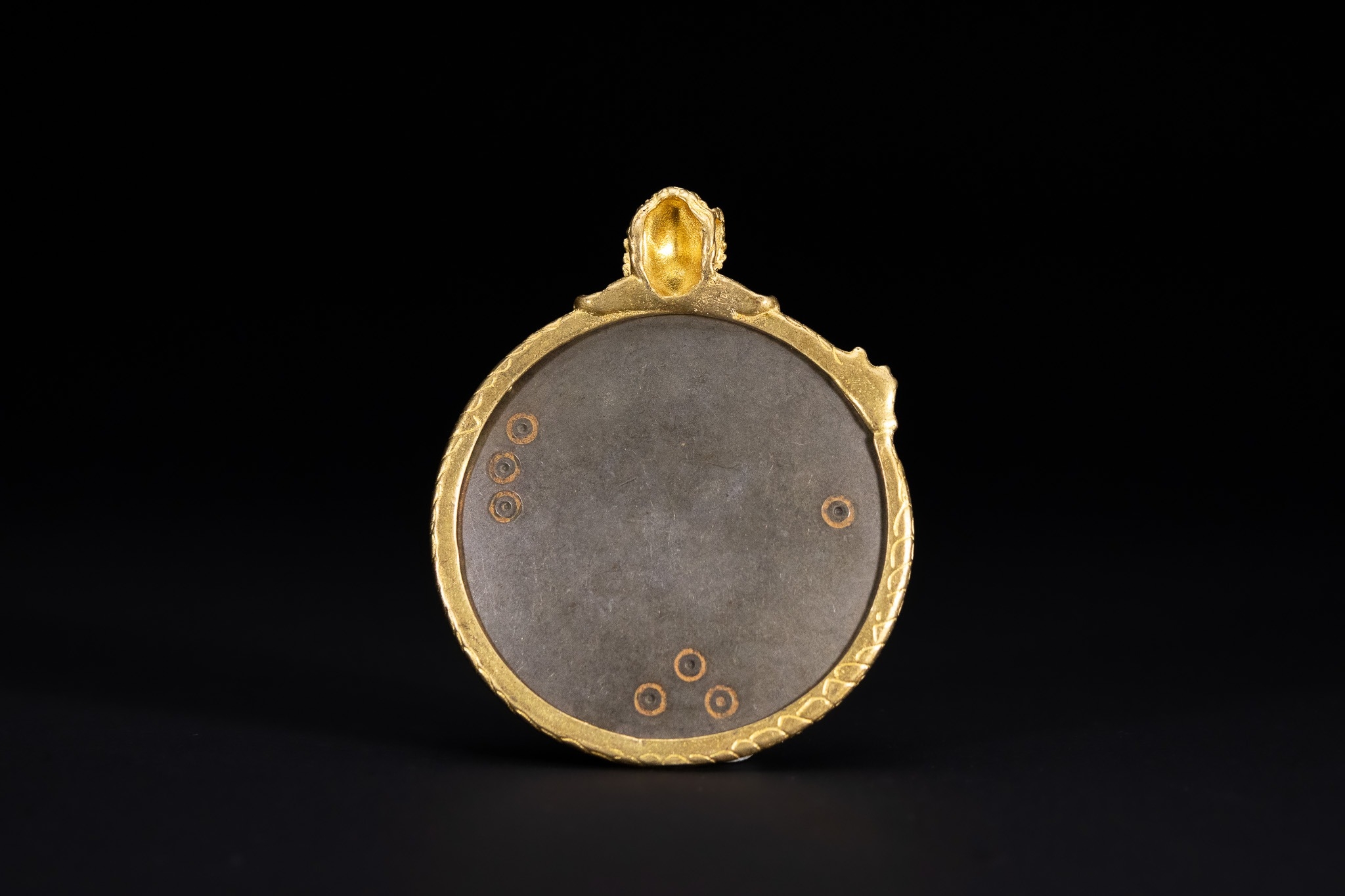 A TIBETAN GILDED COPPER ALLOY AND IRON ASTROLOGICAL MELONG PENDANT ...