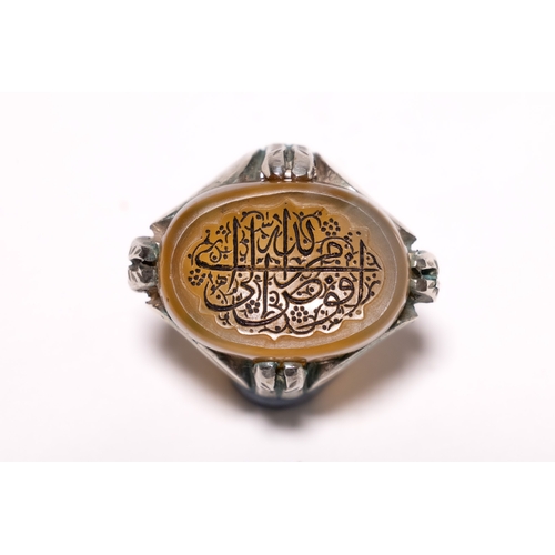 AN ISLAMIC SILVER CALLIGRAPHIC AGATE INTAGLIO SIGNET RING. - An Islamic ...