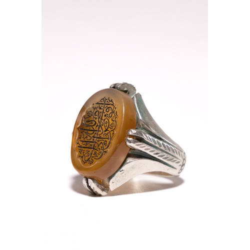 AN ISLAMIC SILVER CALLIGRAPHIC AGATE INTAGLIO SIGNET RING. - An Islamic ...